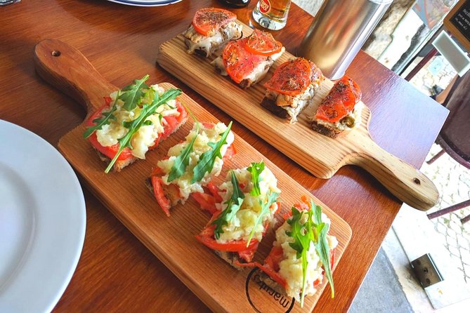 Lisbon Small-Group Food Tour with 18 Tastings in Alfama District - Exploring Alfama’s Historic Charm