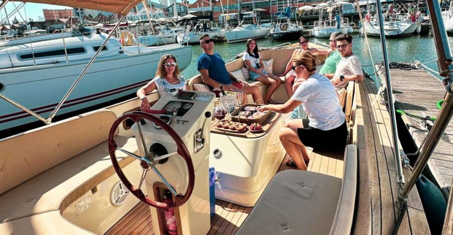 Lisbon Sunset Cruise  Pizza, Pastel de Nata & Open Bar - Starting Point in Doca de Santo Amaro