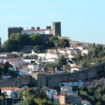 Lisbon to Porto stop Óbidos, Nazaré, Fátima, Coimbra, Aveiro - Pickup and Drop-off in Lisbon and Porto