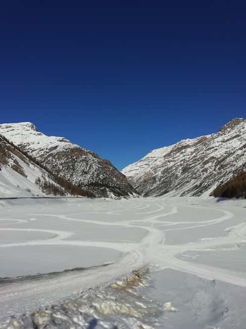 Livigno: Snowmobile Ride on Lake Livigno in the Alps - How the Snowmobile Experience Unfolds
