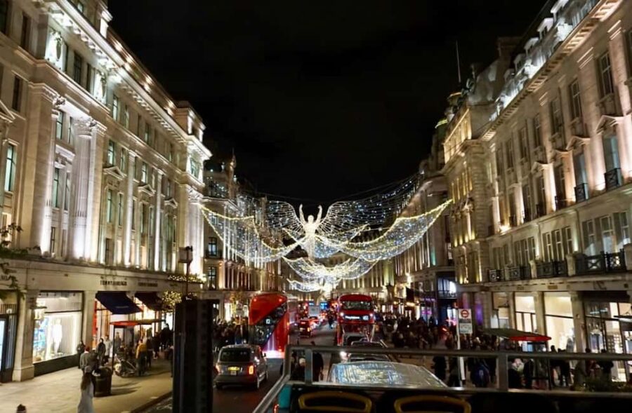 London: Christmas Lights Open-Top Bus Tour - Passengers Board on an Open-Top Yellow Bus
