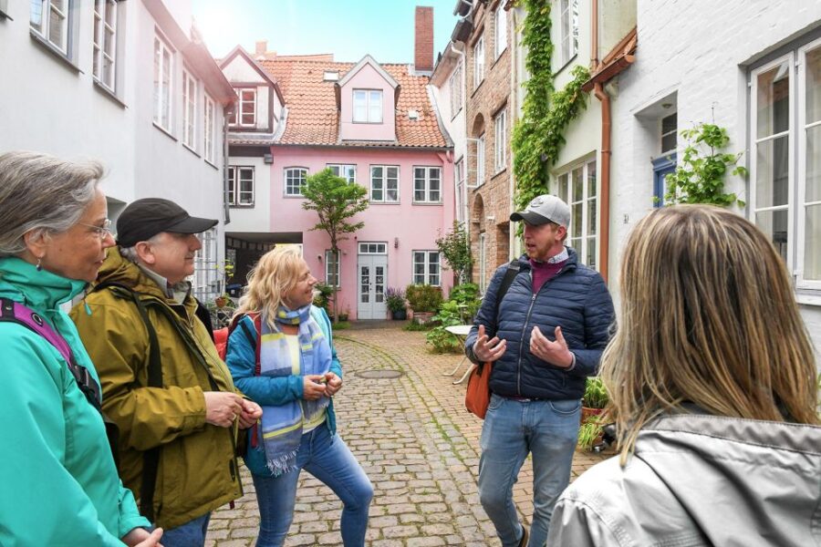 Lübeck: Entertaining Tour Through Hidden Courtyards - Starting Point in Front of the Burgtor
