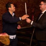 Madrid: Not Just Another Tapas & Wine Tour - Slicing Jamón Ibérico in an Authentic Cellar Setting