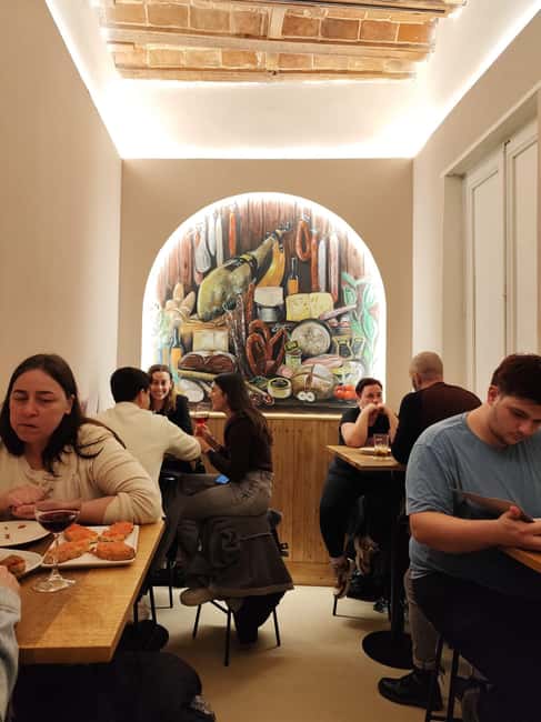 Madrid: Taste typical Spanish tapas, cold cuts, Iberian ham, and wines - Madrid’s Malasaña Neighborhood Hosts a Gourmet Food and Wine Experience