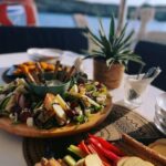 Milos: Kleftiko Sunset Catamaran Cruise with Meal & Drinks - What the Itinerary Includes