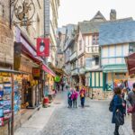 Mont Saint Michel Day Trip from Paris with English Speaking Guide - Exploring Mont Saint Michel: The Abbey and Village