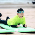 Newquay: Kids Surf Lessons, For 8-13 Years. Fun & Safe! - Start Point at Belushis Bar and Restaurant on the Sea-Facing Terrace