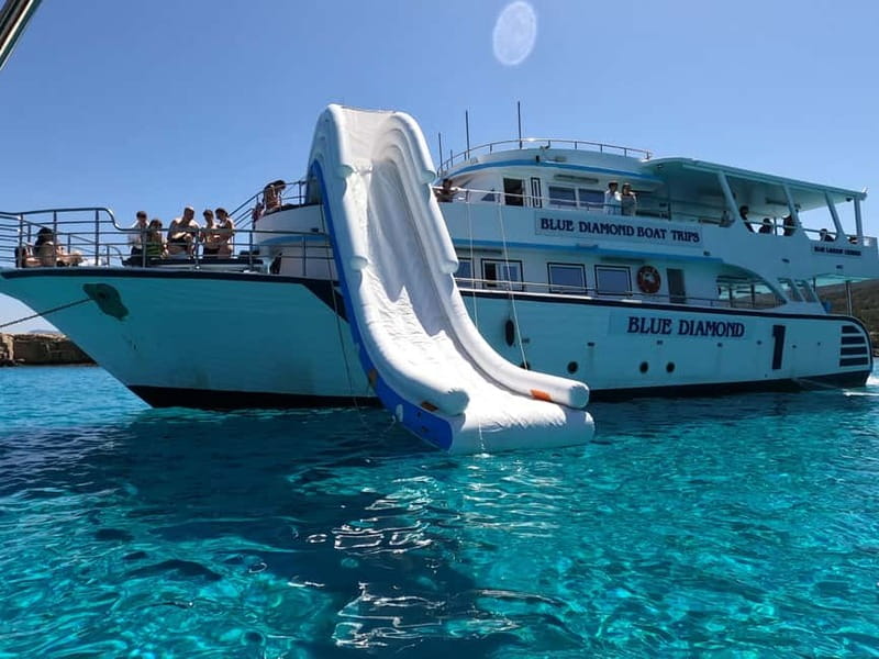 Paphos Blue Lagoon Cruise: Slide, Music & Hotel Transfer - The Blue Lagoon Swimming Stop and Waterslide Fun