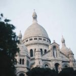 Paris: Montmartre Walking Tour with Sacré-Cur Basilica - Walking Past the Legendary Moulin Rouge