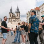 Prague: Old Town, Prague Castle & River Cruise Day Tour - Exploring Charles Bridge with a Guided Walk