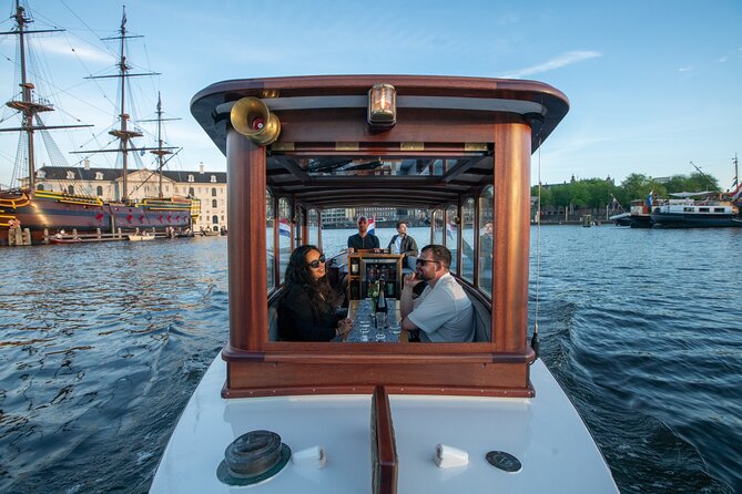 Private Boat Tour Amsterdam - 90 Min incl. welcome drink on historic saloon boat - Embark from Oosterdokskade for a Central Starting Point