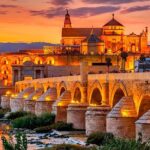 Private Cordoba & Seville Tour with a Finale Horse Carriage Ride - Exploring La Juderia and the Roman Bridge