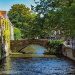 Private Sightseeing Day Trip to Ghent and Bruges from Amsterdam - Visiting Gravensteen Castle: A Medieval Fortress with a Witty Guide
