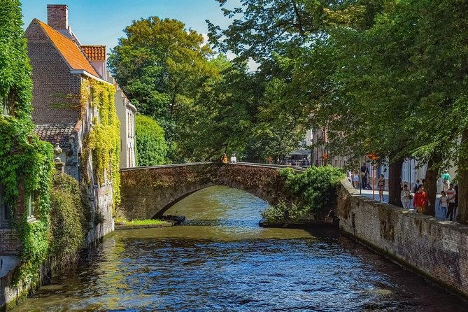 Private Sightseeing Day Trip to Ghent and Bruges from Amsterdam - Visiting Gravensteen Castle: A Medieval Fortress with a Witty Guide