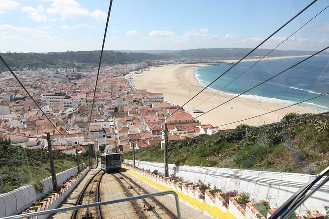 Private Tour to Nazaré and Alcobaça, giant waves and a monastery - Exploring Nazaré’s Traditional Fish Market and Coastal Charm