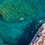 Rhodes Exclusive Swim Cruise with Greek Gourmet Buffet & Drinks - Afandou Beach: Long Pebble Shore and Historical Site