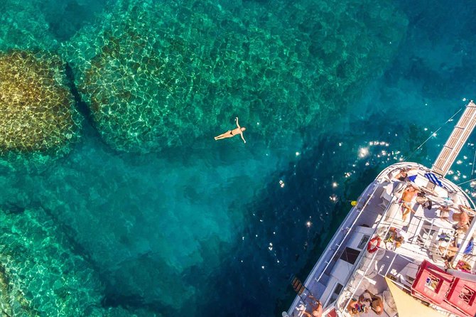 Rhodes Exclusive Swim Cruise with Greek Gourmet Buffet & Drinks - Afandou Beach: Long Pebble Shore and Historical Site