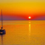Rhodes: Sunset Catamaran Cruise with Dinner, Drinks & Swim - Starting Point at Mandraki Harbor for a Scenic Sail Along Rhodes Coastline