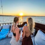Rhodes: Sunset Cruise with Greek BBQ and Unlimited Drinks - Rhythmic Scenic Voyage with a Guide