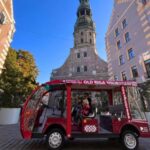 Riga: Old Town E-Bus Tour with Audio Guide & Welcome Drink - Discovering Livu Square and Its Vibrant Atmosphere