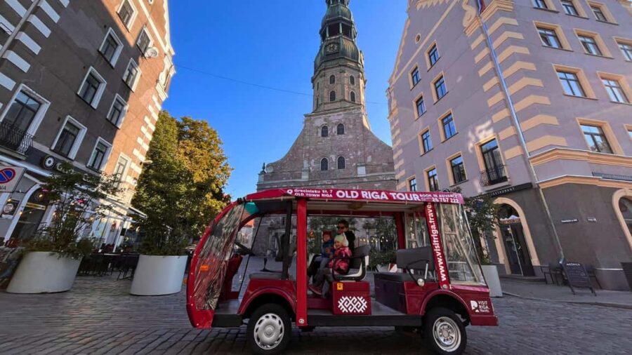 Riga: Old Town E-Bus Tour with Audio Guide & Welcome Drink - Discovering Livu Square and Its Vibrant Atmosphere