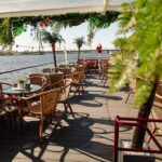 Riga: Sunset trip to Sea gates - River Cruises Latvia - The Modern VECRGA Boat: Comfort and Style