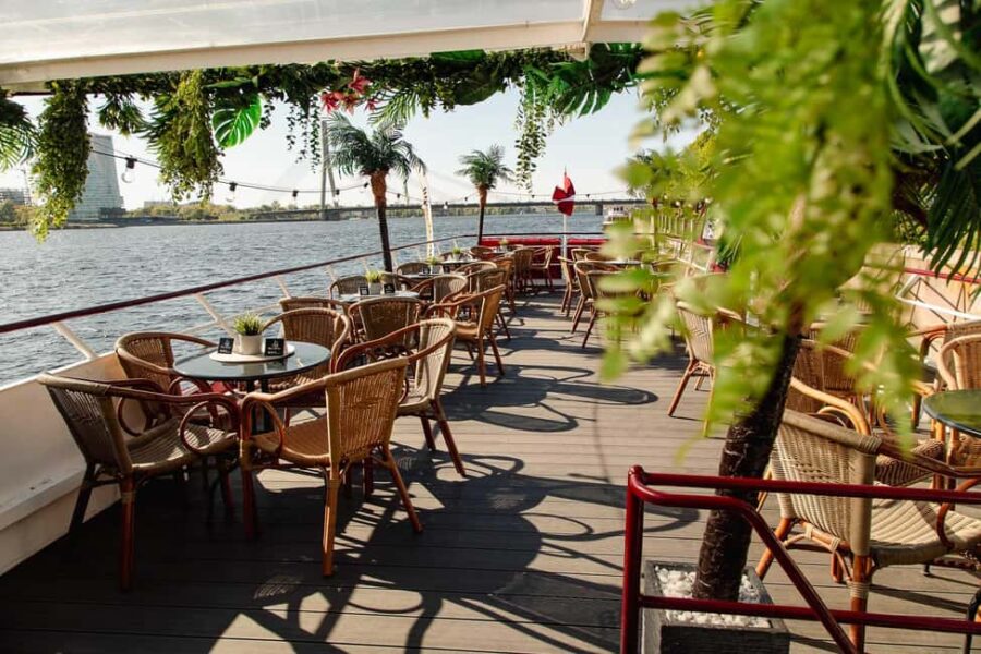 Riga: Sunset trip to Sea gates - River Cruises Latvia - The Modern VECRGA Boat: Comfort and Style