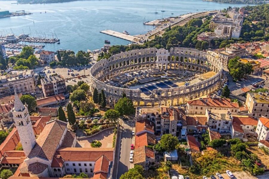 Rijeka: Pula, Rovinj, and Panoramic Istrian Coast Tour - Visiting Pulas Roman Amphitheater and Roman Monuments