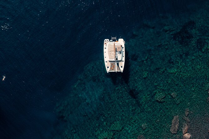 Romantic Sunset Catamaran Caldera Cruise incl. Meal & Drinks - Exploring Santorini’s Iconic Beaches and Volcanic Landscape