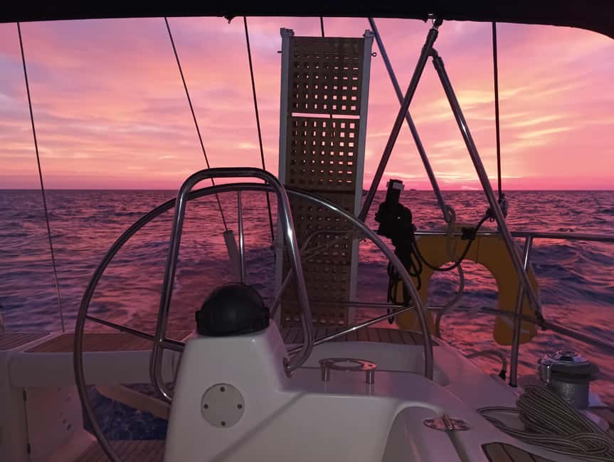 Romantic Sunset Cruise in Kissamos: Music, Wine, Giving Back - Witness the Sunset Behind the Cretan Mountains