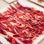 Sagrada Familia Jamón Iberico Masterclass with Wine Tasting - Exploring the Location: From the Sagrada Familia to the Gourmet Jamonería