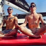 Santorini Adventurous Catamaran Experience with Snorkeling - Passing the Iconic Venetian Lighthouse and Black Mountain