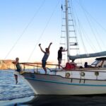 Santorini Caldera Sunset Traditional Cruise with Meal and Drinks - Sailing Around the Volcano and Exploring the Caldera