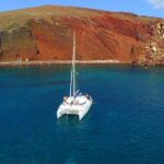 Santorini Full Day Catamaran Private Cruise incl. Meal, Drinks & Free Transport - Exploring the Red Beach’s Unique Volcanic Landscape
