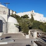 Santorini: Guided Island Day Trip with Beach Visit - Starting the Day at Prophet Elias Monastery and Mountain Views