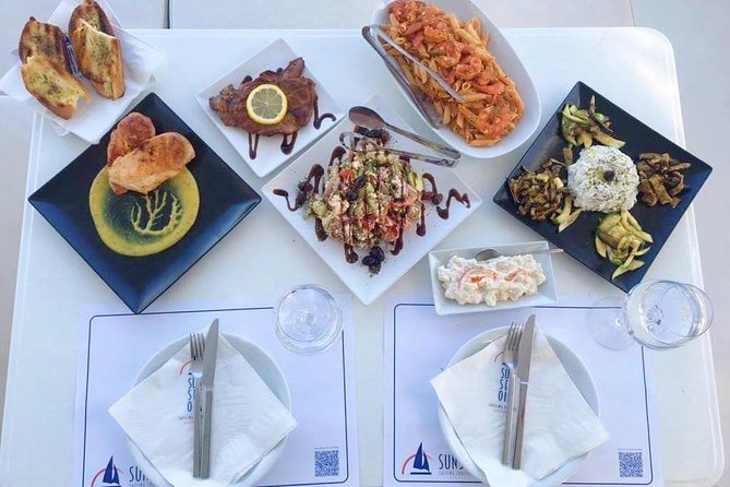 Santorini Luxury Catamaran Sunset Cruise with BBQ, Drink and Transfer - Snorkeling at the Red and White Beaches