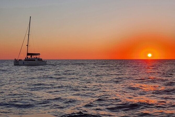 Santorini Private Catamaran Cruise with BBQ, Open Bar & Transfers - White Beach: Exclusive Access and Crystal-Clear Waters