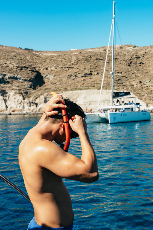 Santorini: Private Catamaran Tour with BBQ Meal and Drinks - Navigating Santorini’s Iconic Coastline