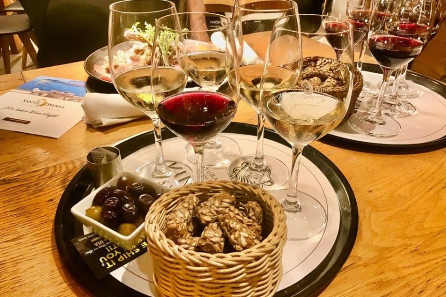 Santorini: Private wine tasting and local music tour - Visiting the Historic Canava for Traditional Wine Storage