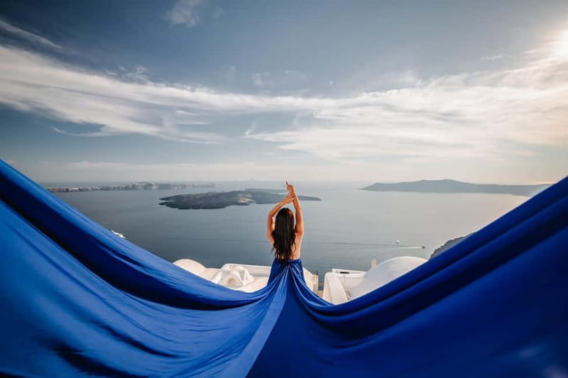 Santorini:Flying Dress shoot with Professional photographer - Starting Point at Local Oia Bus Stop