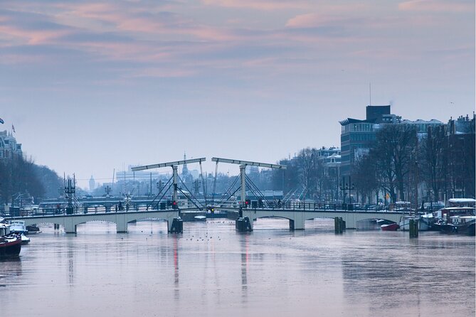 Self-guided city walking tour in Amsterdam - Exploring Iconic Landmarks like Victoria and Beurs van Berlage