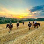 Siena: Horseback Riding with Siena in the background - Riding Through Chianti and Crete Senesi Landscapes