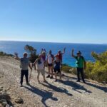 Small group hiking between the beach and Kritinia Castle - Descending through Aromatic Landscapes Toward the Pebble Bay