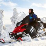 SnowSurge: Adult Snowmobiling Adventure - Snowmobile Safari Through Snow-Covered Forests and Mountain Vistas