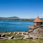 Yerevan: Garni Temple, Geghard Monastery, & Lake Sevan Tour - Exploring Geghard Monastery’s Cliff Carvings