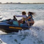 3 Hour Party Boat Jet ski Banana Tube and open bar in Miami - Thrilling Water Activities with Bluetooth-Equipped Jet Skis