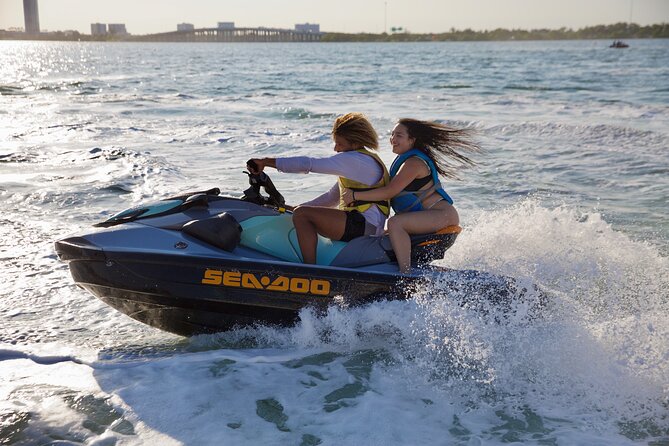 3 Hour Party Boat Jet ski Banana Tube and open bar in Miami - Thrilling Water Activities with Bluetooth-Equipped Jet Skis