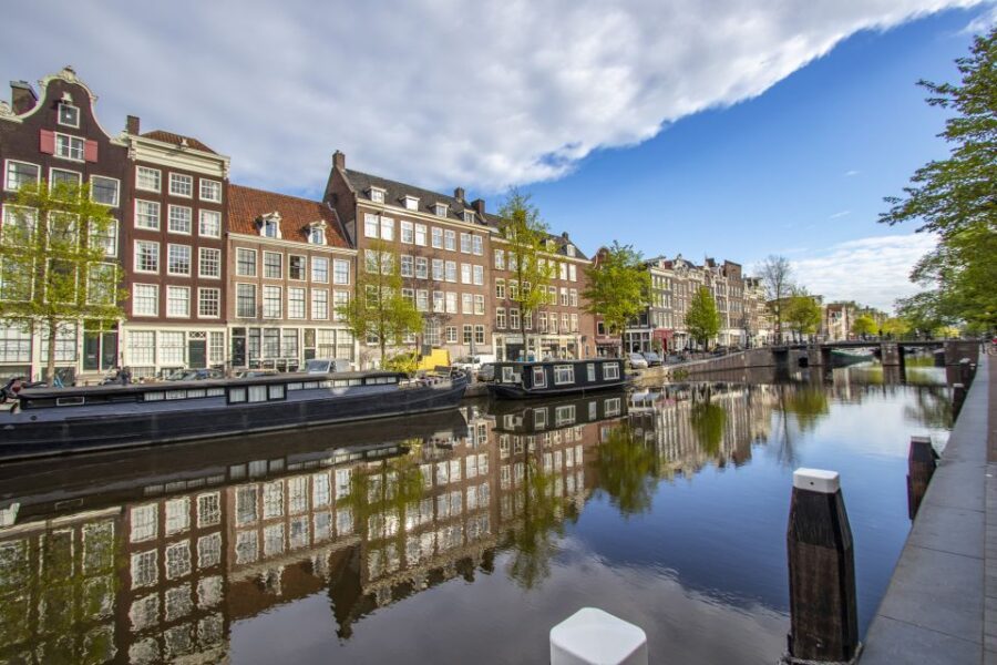 Amsterdam: Express Walk with a Local in 90 minutes - Meet in Front of Amsterdam Centraal’s Clock Tower for a Punctual Start