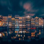 Amsterdam Layover: Walking Tour & Canal Cruise + Airport Transfer - Exploring the UNESCO Canals on a Glass-Topped Boat