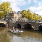 Amsterdam Open Boat Tour with Local Guide - Step-by-step Journey Through Amsterdam’s Famous Canals